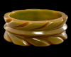 vintage wide slash carved olive green bakelite bangle